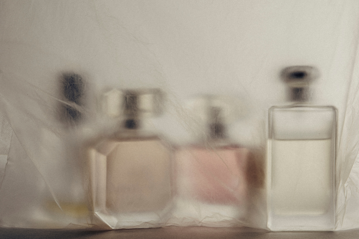 groups of perfume bottles on a blurry background