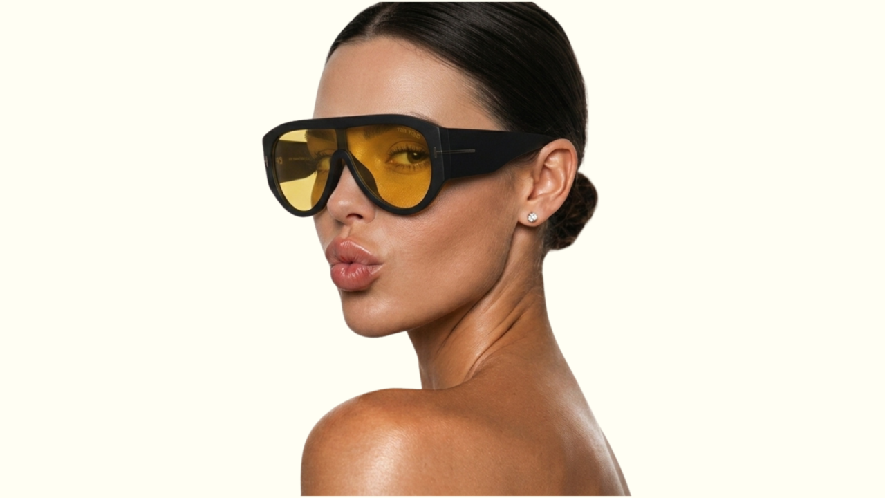 image of woman wearing bol around sunglasses with her slicked back and making a kissy face