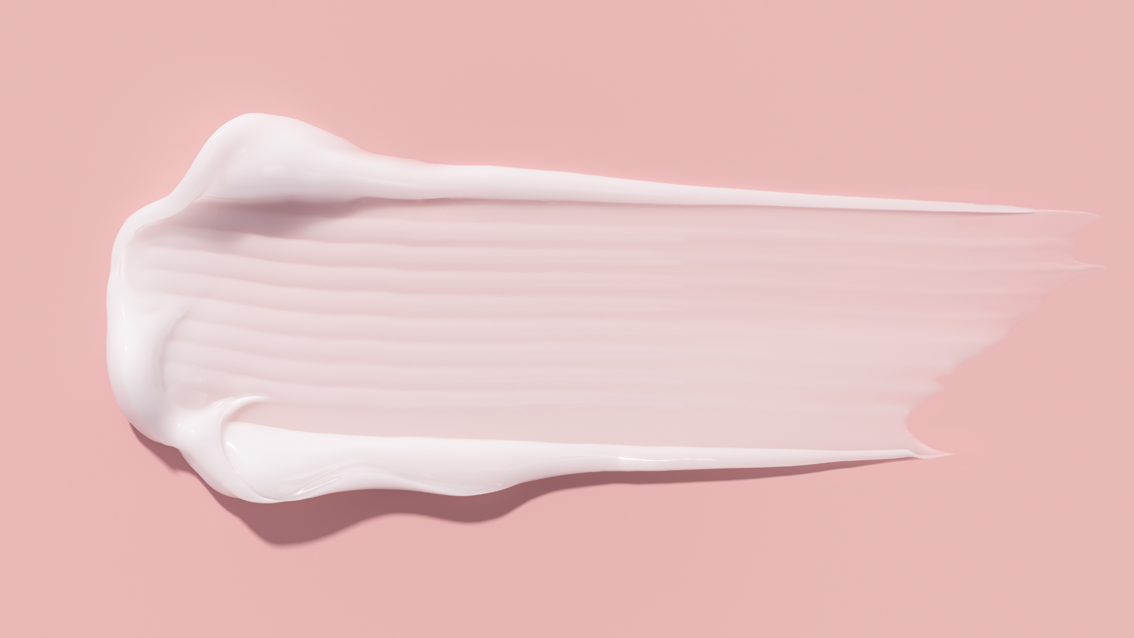 flat lay shot of a smear of moisturizer showing its luxe texture